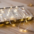 Star shaped LED copper wire fairy lights with warm white glow on a vintage book - Star/2M 20LED
