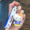 Cute Hello Kitty 3D keychain with blue rubber wrist strap and golden hardware hooks - Hello Kitty-Blue Skirt with Bow