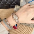 Rose gold snake-head watch with drop-shaped dial and scale-link metal bracelet on wrist - Rose Gold