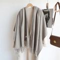 Elegant grey cashmere-like scarf with fringe on a wooden hanger with aesthetic styling - Mocha / 200cm