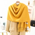Thick yellow cashmere scarf with tassels draped over a beige coat in a cozy setting - 200*70cm / Fluffy Warm Tassel Style / Ginger Yellow