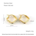 Detail of 18K gold plated square hoop earrings featuring zircon inlay and side engraving - Square Gold Style (ZE639G)