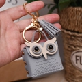 Chic grey leather owl coin purse keychain with stylish tassel and gold hardware - Gray