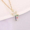 Macro shot of 18K gold letter F crown pendant with colorful inlaid cubic zirconia stones - Letter F Style