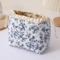 Quilted cosmetic bag with blue floral print, large capacity portable travel drawstring storage pouch. - Navy Tablecloth Floral