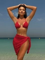 Detailed close-up of the red textured bikini set and matching mesh sarong cover-up - S / Red