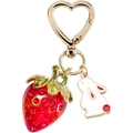 Close-up of a red strawberry and white rabbit keychain with a golden heart clasp - Red 5