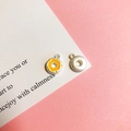 Detailed view of silver and yellow enamel donut pendants for DIY necklaces - 6# Orange Doughnut Matte Silver