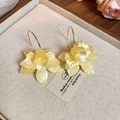 Detailed view of yellow flower acrylic earrings with golden hooks and resin texture - 25# Silver Pin - Pale Yellow - Pearlescent Flower