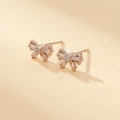 Elegant rose gold bow stud earrings featuring sparkling zircon inlay and 14K gold plating - Rose Gold Bow