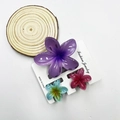 Three-piece plumeria flower hair claw clip set in purple, cyan, and rose resin - Mixed Color Set #21 (includes Cards)