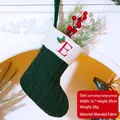 Green knit Christmas stocking with letter E embroidery and festive holly leaf details - Embroidered Knit Christmas Stocking-E