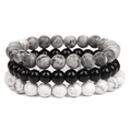 Close-up of a three-piece elastic bracelet set with black, white marble, and grey stone beads - 8mm Map Stone & Onyx & White Turquoise