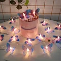 Blue and purple butterfly LED string lights on a marble vase for festive garden decor - Pink Purple Gradient Butterfly-2 AA Battery Box 1.5M 10 LEDs Steady On