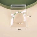 Transparent 11x7.5cm PVC jewelry bag with a gold bracelet featuring pearls and green beads - 7.5x11cm/26 Silk Thickness / Clear