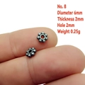 Detail view of 6mm silver flower spacer beads with 2mm thickness and 2mm hole size - 8# (6x2mm)