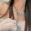 Silver vintage butterfly necklace with water drop pendant on a female model - Silver Butterfly Tassel Necklace