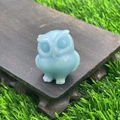 3.5cm natural light blue gemstone owl figurine on wooden base in nature setting - Sky Blue Luminous