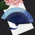 Blue folding fan with cherry blossom pattern, bamboo ribs and matching blue tassel - Ink Blue Cherry Blue Handle