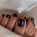 Macro shot of black cat-eye press-on toenails with metallic luster on white silk - Minimalist Black Cat Eye Highlight Style (FW127)