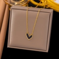 Elegant gold titanium steel necklace featuring a black and gold heart pendant charm - Heart Black and White Pendant Necklace (QYH214) / Gold