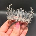 Close-up of a silver hair comb with crystal clusters on intricate branch design - Transparent + Branch