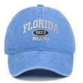 Close-up of white Florida and Miami embroidery on blue washed cotton baseball cap - Light Blue