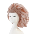 Pink satin hair bonnet featuring a large decorative bow on a white mannequin head - Medium Single Layer Ribbon / Champagne