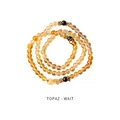 Three-wrap yellow topaz beaded bracelet featuring golden flower spacers on a white backdrop - Garnet Citrine Multilayer Style (WB335)