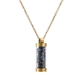Close-up of golden capsule pendant necklace filled with blue crushed natural stones - Gold Lapis Lazuli