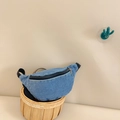 Blue denim crossbody belt bag for kids with black zipper on a rustic basket - Light Blue
