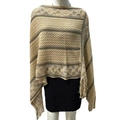 Close-up detail of knitted poncho featuring ethnic diamond patterns and fringe tassels - Twill Light Khaki