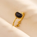 Macro shot of gold stainless steel adjustable ring with oval black marble stone - Gold Base-Black Marble Stone