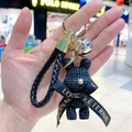 Black resin knit-texture bear keychain with gold metal ring and braided leather strap - Black Rabbit