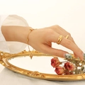 Adjustable golden heart charm bracelet with layered and textured rings for women - 25cm / Gold