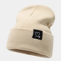 Winter beige ribbed knit beanie with heart patch for outdoor warmth and comfort - One Size / Beige