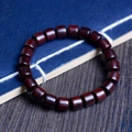 Polished deep reddish-brown wooden barrel bead bracelet with natural grain and oil finish - Pterocarpus Tinctorius Barrel Beads / 8mm x 22 Pieces / Reddish Brown