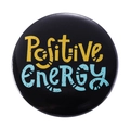 Round black tinplate badge featuring Positive Energy slogan in vibrant yellow and cyan - Positive ENERGY