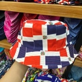 Detailed view of bucket hat featuring Dominican flag colors and national emblem pattern - 8# Dominican Flag