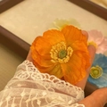 Realistic orange poppy hair clip featuring detailed yellow stamens for a summer beach look - Orange Poppy