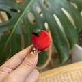 Cute red apple acetate hair claw clip for women in a lifestyle hand-held product shot - Red Apple