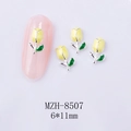 Macro detail of 6x11mm yellow tulip nail art charms with silver edges and green leaves - Yellow Tulip Silver Base (8507)