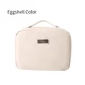 Eggshell beige makeup bag in lychee pattern leather with a metal label and top handle - Eggshell (Leather Handheld)