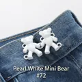 Pearl white mini bear waist tightener pins for jeans resizing on blue denim fabric - Hand-sewn Bear / Pearl White