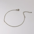 Detailed macro view of 1.5mm stainless steel cross chain with lobster clasp and extender - Steel Color (18+5cm)