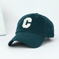 Detailed close-up of white embroidered letter C on a dark green cotton baseball cap - One Size Adjustable / Dark Green