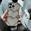 Silver glitter iPhone case featuring three 3D layered metallic hearts on a shiny surface - Electroplated Silver Stacked Heart + Glitter Paper / iPhone 11
