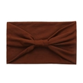 Detail view of brown wide cotton yoga headband with a soft knot bow in knit texture - Coffee