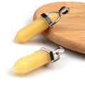 Polished yellow crystal hexagonal point pendant with silver clasp on wood base - Yellow Jade