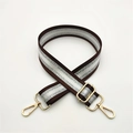 Detail of adjustable dark brown striped strap with glittering silver and gold metal hooks - Brown